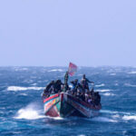 watch:-tourists-tackle-illegal-boat-migrants-landing-on-spanish-beach