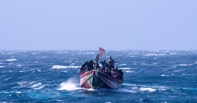 watch:-tourists-tackle-illegal-boat-migrants-landing-on-spanish-beach