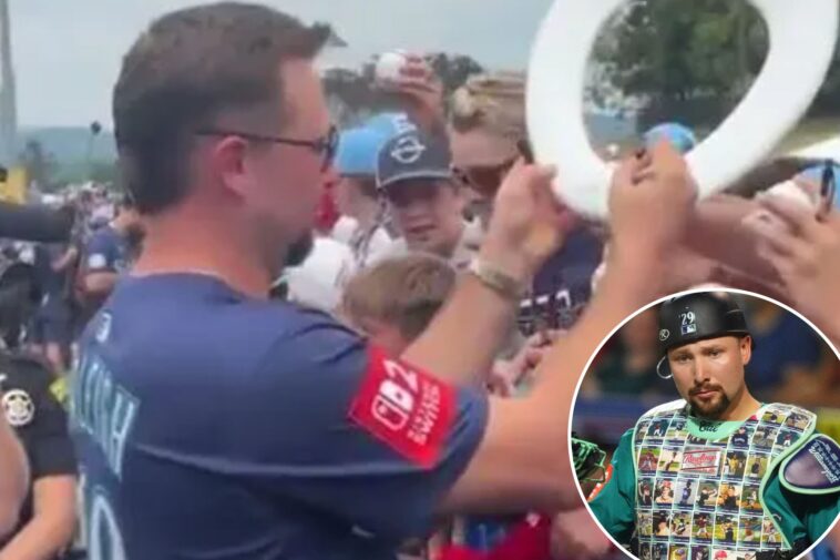 mariners’-cal-raleigh-signs-bathroom-item,-dons-custom-chest-protector-at-little-league-classic