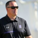 n’western,-ex-football-coach-fitzgerald-settle-suit
