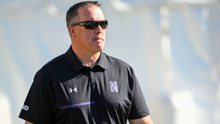 n’western,-ex-football-coach-fitzgerald-settle-suit