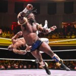 wwe-star-oba-femi-throws-opponent-through-table-from-ring-during-heatwave-match,-retains-title