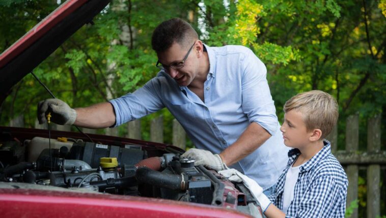 dad-teaches-son-importance-of-doing-your-own-oil-changes-so-it-will-take-longer-and-cost-more