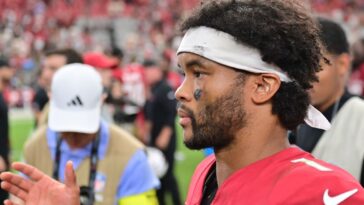 cards’-murray-sorry-for-post-with-vick-jersey,-dog