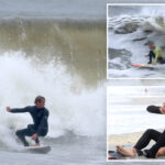 thrill-seeking-surfers-flock-to-nyc-for-gnarly-10-foot-nor’easter-waves:-‘floating-between-mountains’