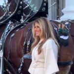 first-lady-melania-trump-dazzles-in-winter-white-as-she-receives-white-house-christmas-tree-(video)
