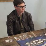 man-torn-between-learning-new-board-game-or-getting-phd-in-quantum-physics