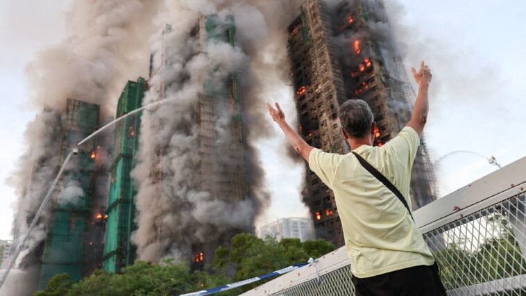 fire-tears-through-hong-kong-housing-complex,-killing-at-least-13-with-others-reported-trapped