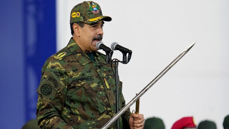 maduro-brandishes-sword-at-rally-as-he-rails-against-‘imperialist-aggression’-amid-rising-tensions-with-us