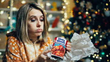 woman-beginning-to-suspect-husband-didn’t-start-shopping-till-yesterday-as-she-opens-can-of-dinty-moore-beef-stew