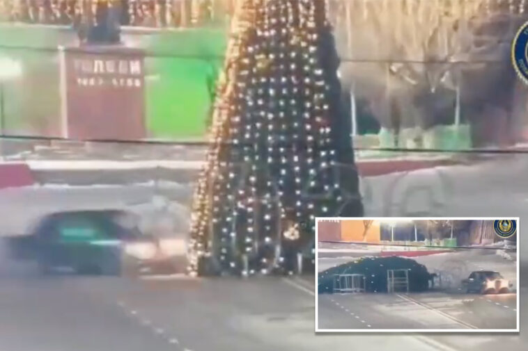 joyride-ends-in-disaster-as-driver-smashes-into-towering-christmas-tree-in-kazakhstan-–-and-is-ordered-to-fix-it