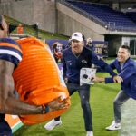 utsa-coach-hilariously-tries-to-escape-celebration-shower,-ends-up-in-dogpile