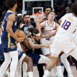 pelicans-guard-connects-with-right-hook-in-fight-with-suns-opponent