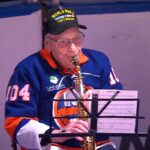 inspiring:-104-year-old-ww2-veteran-plays-national-anthem-on-saxophone-at-nhl-derby-match-(video)