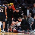 nuggets-star-nikola-jokic-limps-off-early-in-loss-to-heat-after-knee-injury