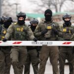 must-see:-ice-agent-rescues-rose-from-ground,-gifts-it-to-grateful-female-agent-in-middle-of-chaotic-demonstration