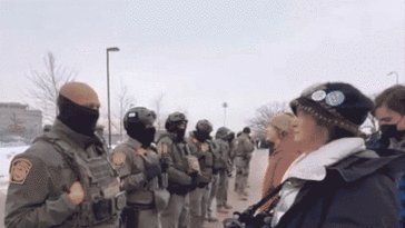 border-patrol-agent-hugs-protester-in-heartwarming-moment-caught-on-video-during-minnesota-operation