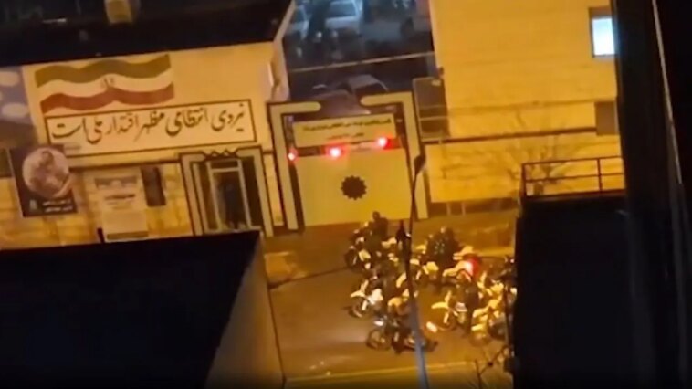 armed-iran-protesters-battle-police-in-tehran-streets-as-trump-warns-of-forceful-us-response