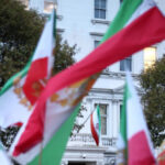 protester-hoists-pre-islamic-revolution-iran-flag-above-london-embassy