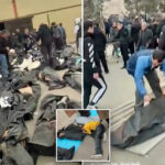 gut-wrenching-footage-shows-grieving-families-in-iran-wailing-and-desperately-searching-through-rows-of-dead-bodies-for-loved-ones