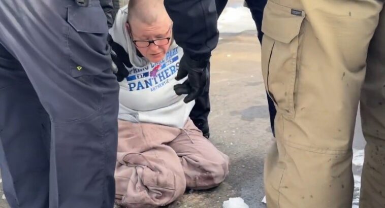 federal-agents-tackle-bald-female-protestor-after-she-throws-water-bottle-at-ice-agents-outside-federal-building-in-minneapolis-(video)