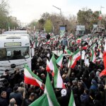 iranian-protesters-hold-trump-assassination-attempt-photo,-chant-‘death-to-america,’-state-media-shows