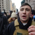 anti-ice-rioters-assault-conservative,-force-man-to-take-off-his-american-flag-hoodie