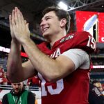 fernando-mendoza-celebrates-national-title-win-with-indiana-priests