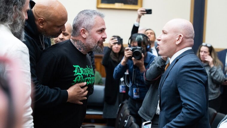 watch-former-dc-police-officer-get-escorted-out-of-jack-smith-hearing-after-fiery-clash