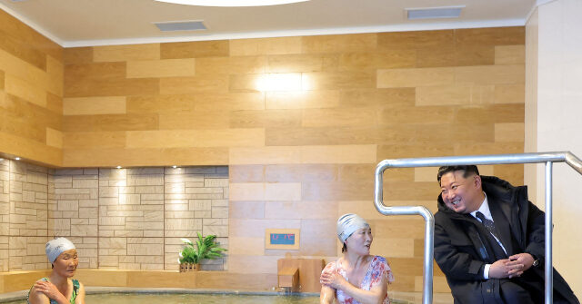 north-korea:-kim-jong-un,-in-massive-coat,-chats-up-visitors-in-swimsuits-at-hot-spring-resort
