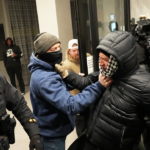 anti-ice-agitators-clash-with-federal-agents-at-minneapolis-hotel,-as-agents-deploy-tear-gas,-flashbangs