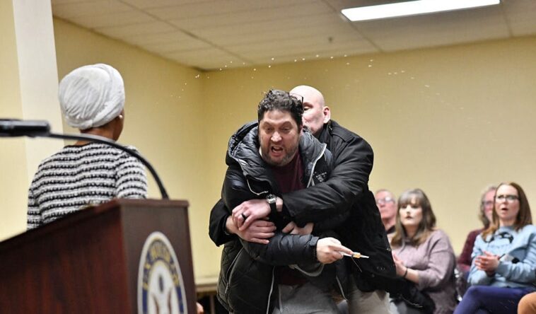 man-rushes-ilhan-omar-at-town-hall,-sprays-her-with-unknown-liquid