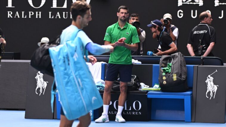 djokovic,-down-2-sets,-advances-when-musetti-hurt