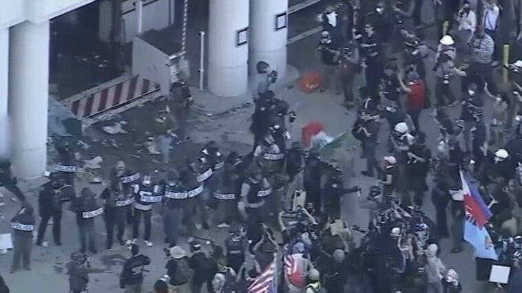 watch:-anti-trump-leftists-attack-local-fox-journalists,-destroy-their-equipment-with-riot-police-standing-5-feet-away