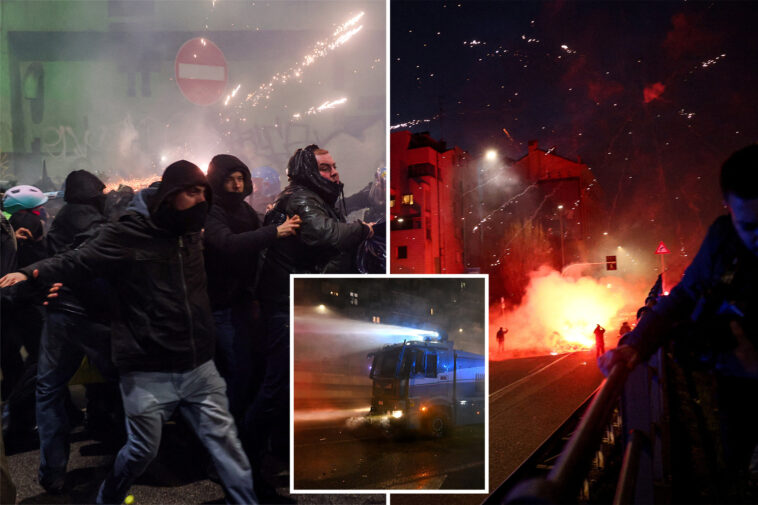 hundreds-of-hooded-protesters-throw-fireworks,-clash-with-police-after-winter-olympics-opening-ceremony-in-milan