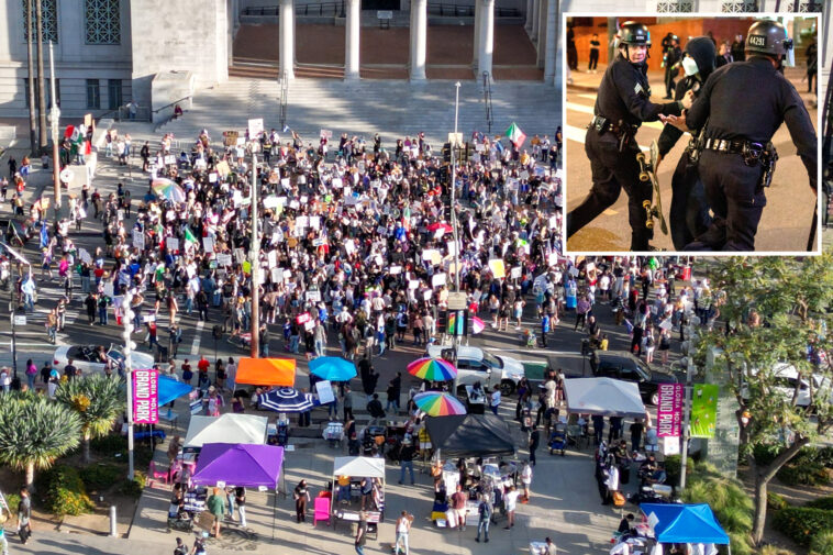 gun-wielding-la-protester-aims-at-feds-then-vanishes-under-pepper-ball-fire
