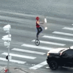 fire-juggling-unicyclist-caught-on-camera-blocking-traffic-in-major-roadway-as-police-intervene