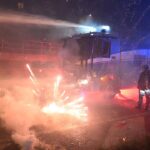 fireworks-fly-as-hooded-protesters-clash-with-police-after-olympics-open-in-milan