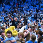 chaos-ensues-at-unc-duke-game-after-fans-storm-court-too-early,-evacuate-for-final-0.4-seconds