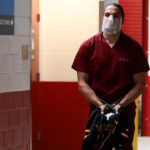 patriots’-mack-hollins-makes-striking-super-bowl-entrance-barefoot-with-mask,-cuffs