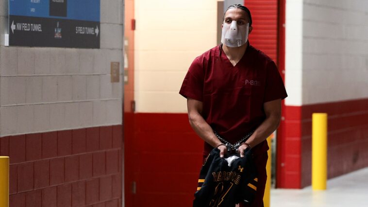 patriots’-mack-hollins-makes-striking-super-bowl-entrance-barefoot-with-mask,-cuffs