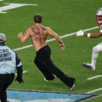 watch:-patriots-player-helps-take-down-field-invader-in-moment-not-seen-during-broadcast