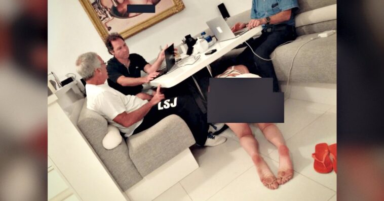 business-meeting,-epstein-style:-disturbing-photo-shows-epstein-and-associates-working-as-bikini-clad-woman-crawls-under-the-table
