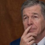 former-north-carolina-dem-gov.-roy-cooper-deletes-post-showing-himself-presenting-id-to-vote