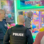 unfazed-missouri-toddler-is-rescued-from-claw-machine-after-getting-stuck-inside,-horrifying-parents