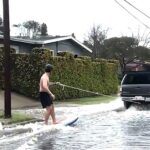 surfer-shreds-waves-on-socal-street-during-wild-flooding:-video