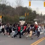 watch:-horrifying-footage-shows-north-carolina-high-school-students-bolt-out-of-class-and-run-across-busy-4-lane-highway-to-protest-ice-–-no-teachers-in-sight