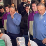 dave-roberts-puffs-on-cigar-while-watching-wing-eating-contest