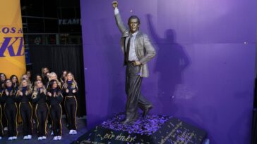 lakers-unveil-statue-of-riley-wearing-armani-suit