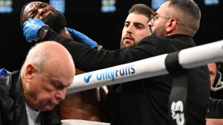 boxer-george-collapses-in-corner,-exits-on-stretcher